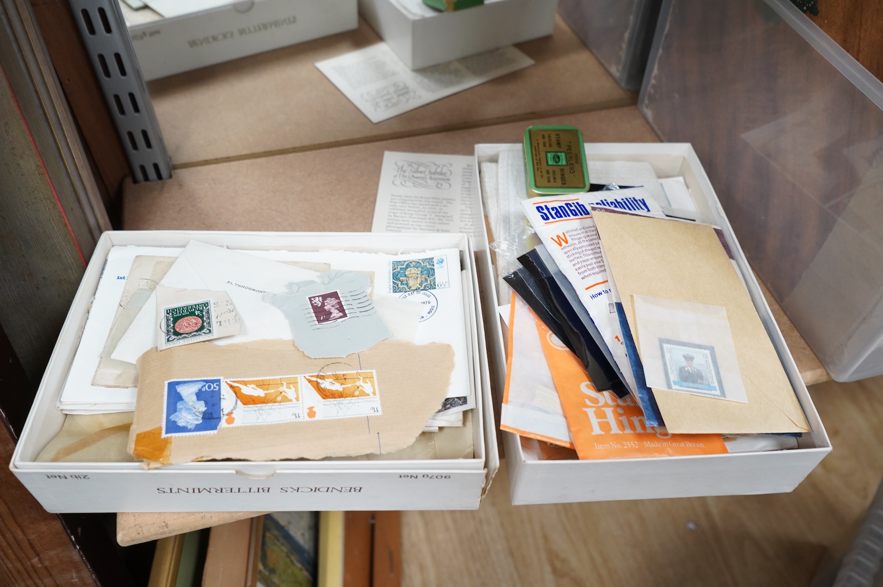 A collection of sundry items to include a scrapbook and a large collection of various stamps
